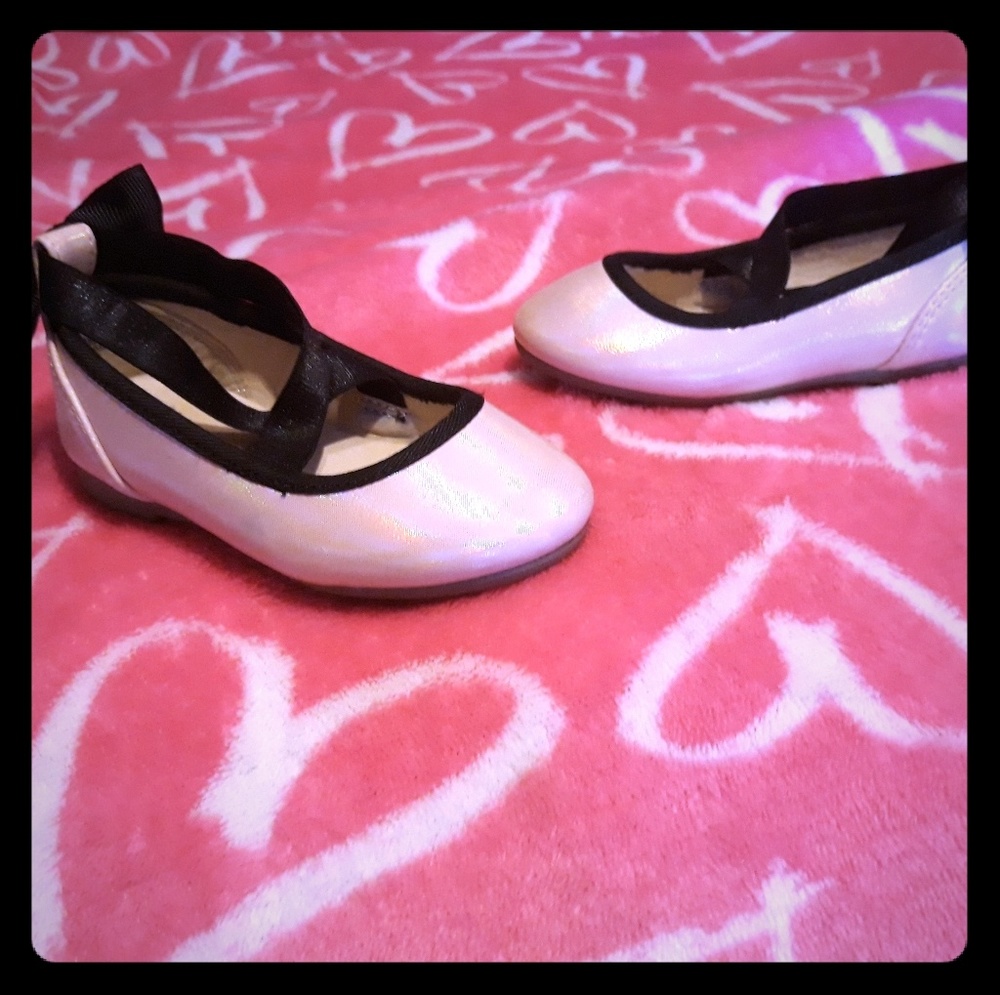 Pink ballet flats with black trimming
